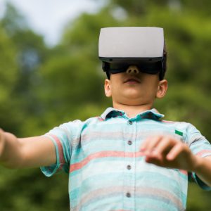 boy with virtual reality headset outdoors