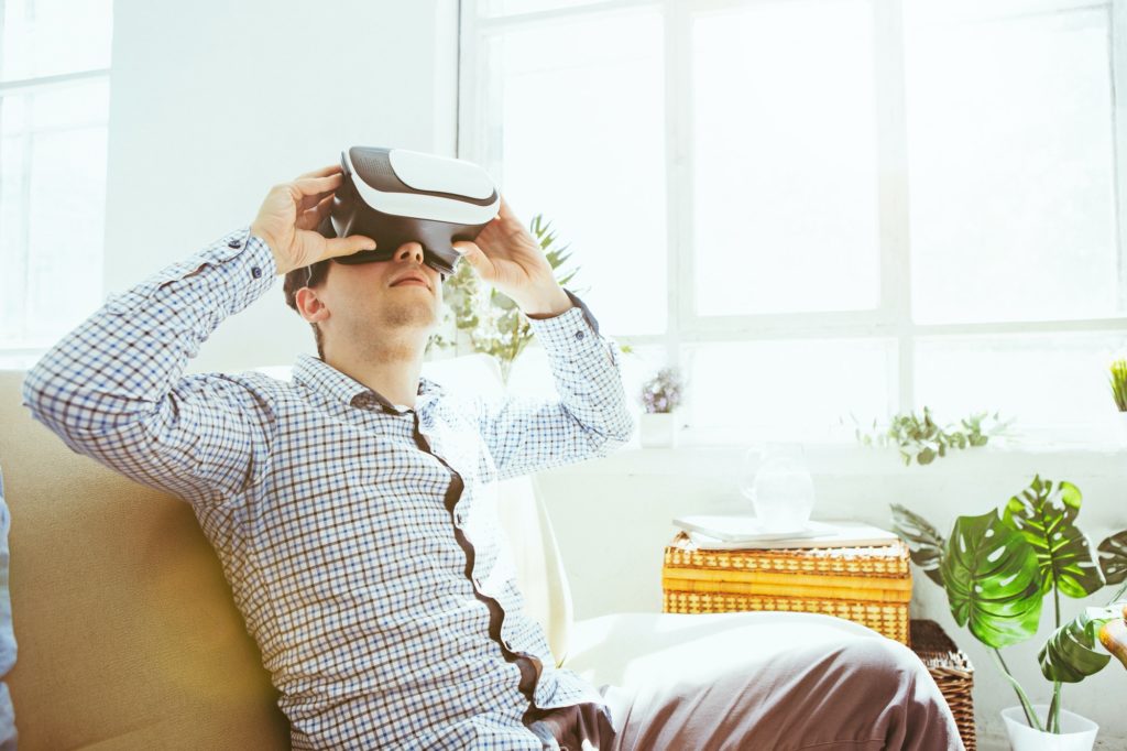 The man with glasses of virtual reality. Future technology concept for real estate business.